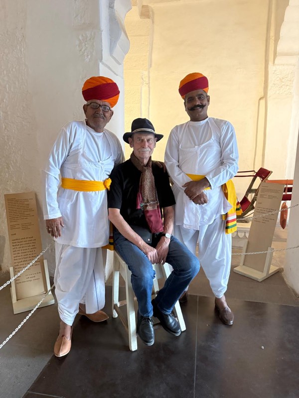 A guest with two turbaned hosts at the fort