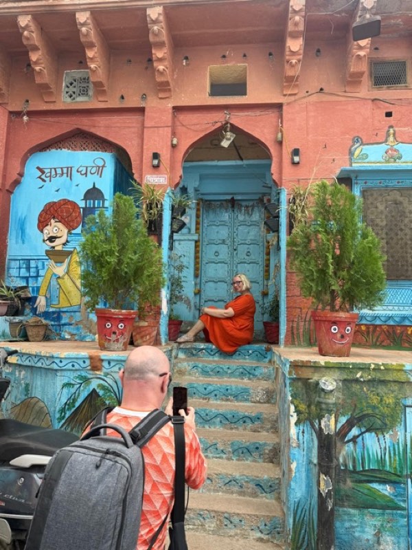 A guest photographing a painted doorway in the lanes
