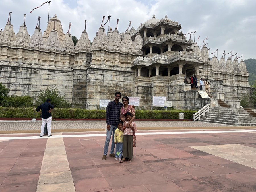 A family outside the marble spires of the Ranakpur Jain temple