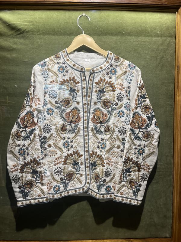 A hand-embroidered cotton jacket on display