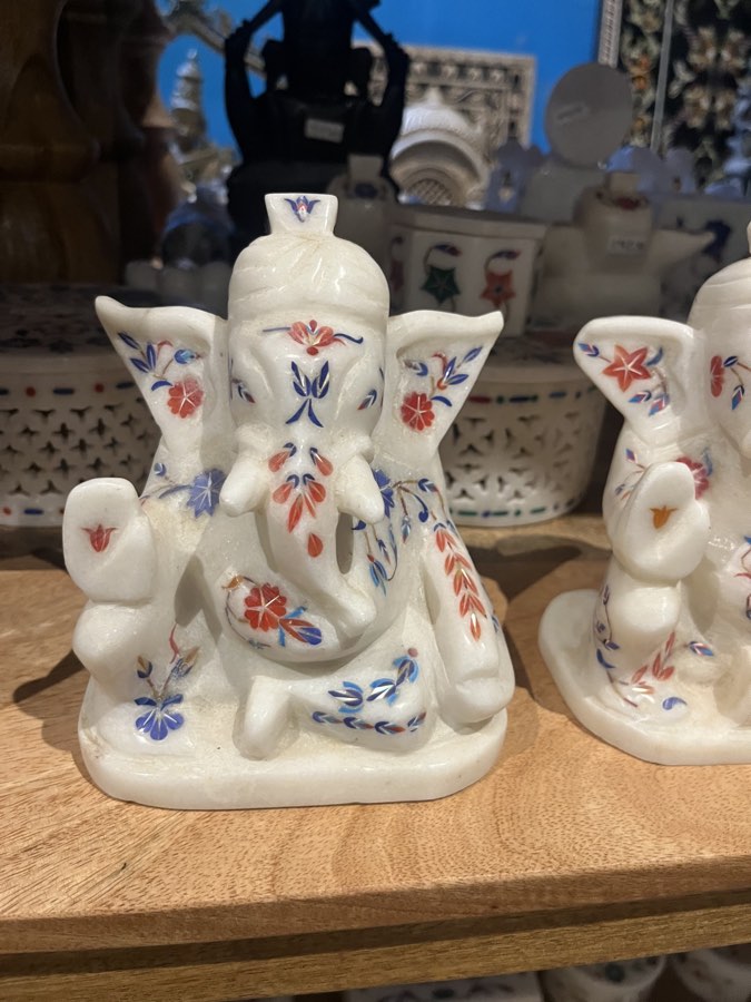 Marble figures with inlaid floral work in a handicraft shop