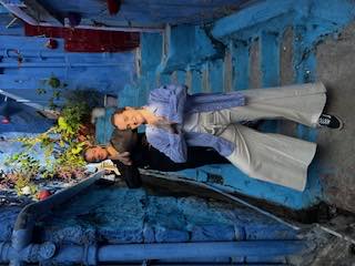 A namaste on the blue steps