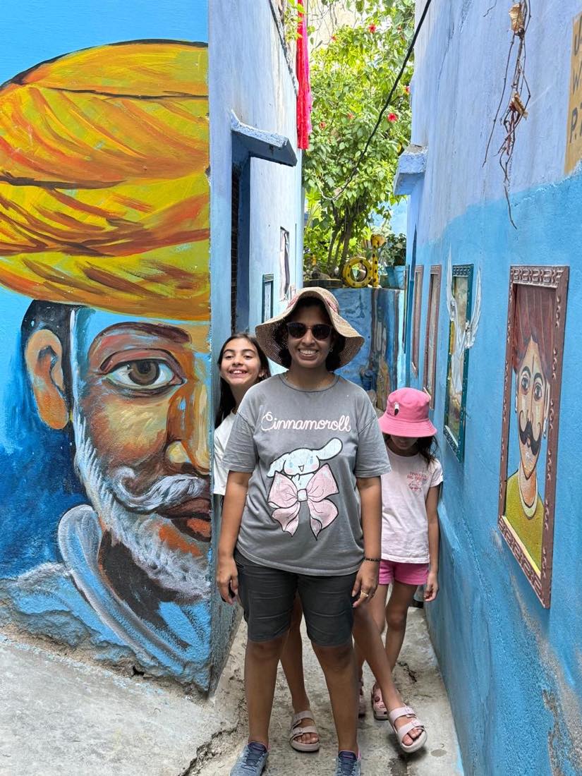 Walking past a mural of a Marwari elder